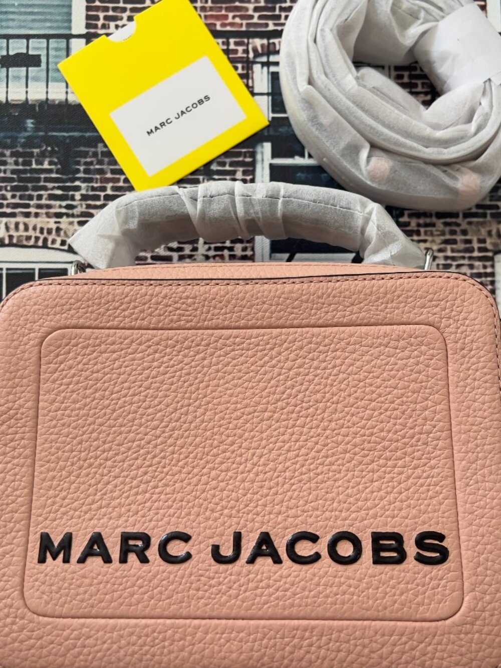 NWT Marc Jacobs The Box bag features a distinctive embossed logo and top handle